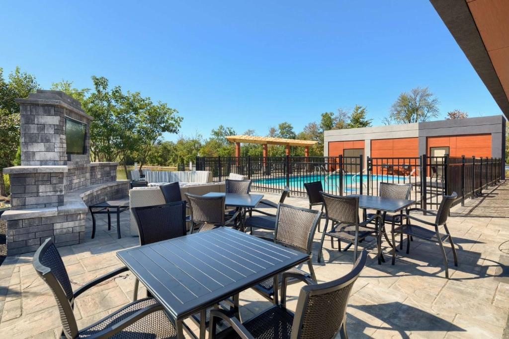 Relax in comfortable outdoor seating by the pool.
