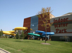 A building with an "Indoor Water Park" sign and colorful, spiraling water slides on the exterior.