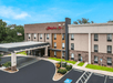 Hotel exterior and outdoor parking spaces.