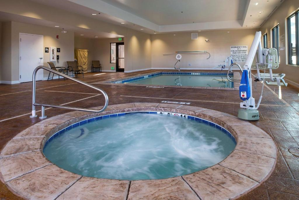 Indoor pool and hot tub on property.