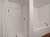 Refresh and relax with a combination shower and tub in the bathroom.
