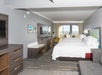 2 Queen beds, work desk, flat-screen TV, seating area at Hampton Inn Saint Augustine Beach, FL.