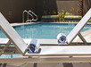 Outdoor pool with sun lounges.