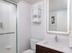 Private bathroom with vanity area and fresh towels.