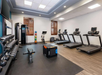 Fitness center including treadmills and other various exercise equipment.