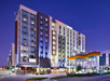 Hotel exterior view at night.