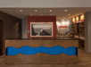 Hotel lobby with a wooden front desk featuring a blue wave pattern. A photo with "explore" on the red wall and a snack area labeled "treats" are in the background.