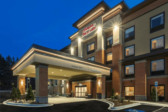 Hotel exterior with parking space.