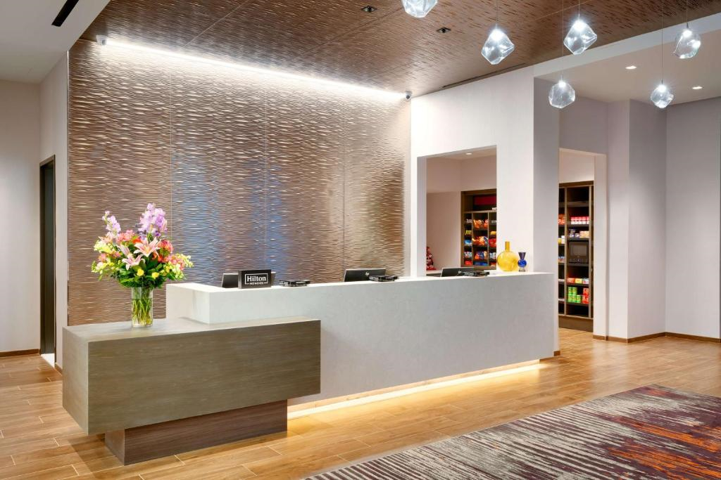 Well-lit front desk and sundry next to it.