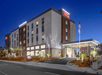 Hotel exterior at night.