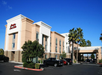 Hotel exterior with parking space.
