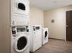 Guest laundry with washing machines and a dryer.