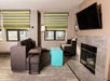 Separate living area with TV in a guest room.
