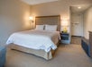 One king bed inside a guest room.