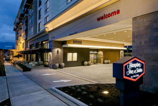Hotel exterior with on-site parking.