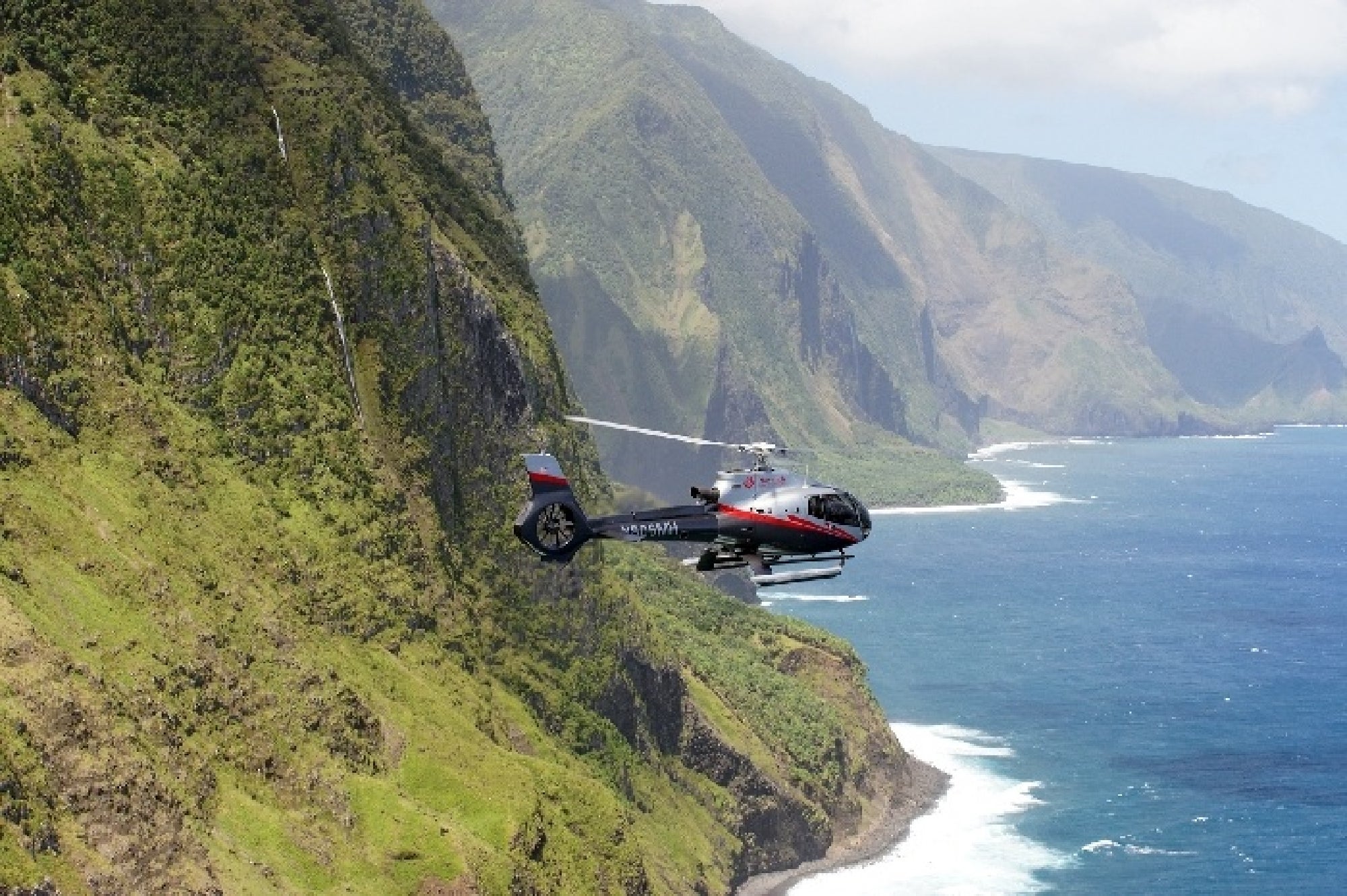 Maverick aircraft cruising above Maui’s breathtaking island vistas.