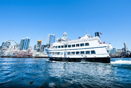 The Argosy Cruise ship cruising in front of the city. Harbor Cruise Seattle Washington.