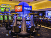 Casino with plenty of slot machines and a game bar.