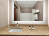 Bathroom with a granite countertop, sink, toiletries, and a mirror reflecting a shower area with towels on a rack.