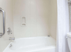 Guest bathroom with bathtub.