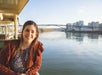 A woman enjoying the Heart of Portland Sightseeing Cruise.