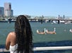 A woman watching Dragon Boats from Starlight Deck.