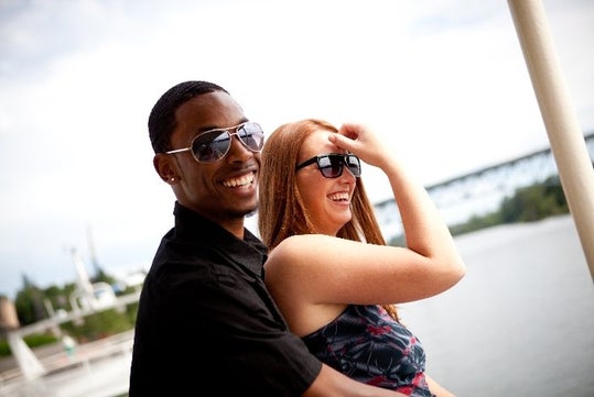 couple laughing and enjoying the Heart of Portland Sightseeing Cruise.