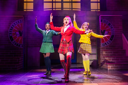 The Heathers command attention in this colorful stage scene.