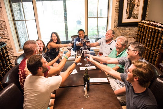 Group toast at Hill Country BBQ & Wine Shuttle in Austin, TX