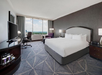 Relax in a guest room featuring one king bed, a work desk, and a flat-screen TV for your comfort and convenience.