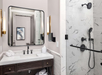 Private bathroom with vanity area, walk-in shower, and fresh towels
