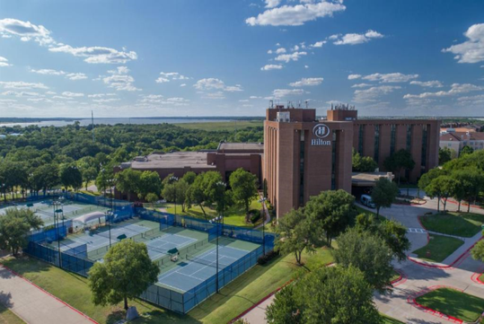 View of the hotel and sports courts.
