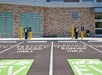 Several electric vehicle only parking spots with chargers in front of them at the Hilton Garden Inn Columbus Easton.