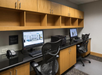 Business center equipped with desktop computers.