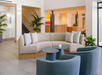 Sit back on the comfortable lobby seating area.
