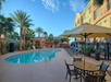 Outdoor pool with sun loungers.