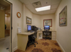 Business center with two desktop computer and a printer.