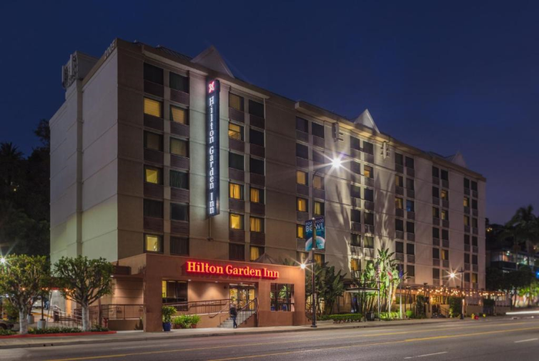 Hotel exterior at night.