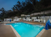 Outdoor pool with lounges.