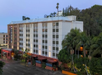 Hotel exterior at dusk.