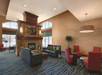 Relax in the lobby with soft seating and fireplace.