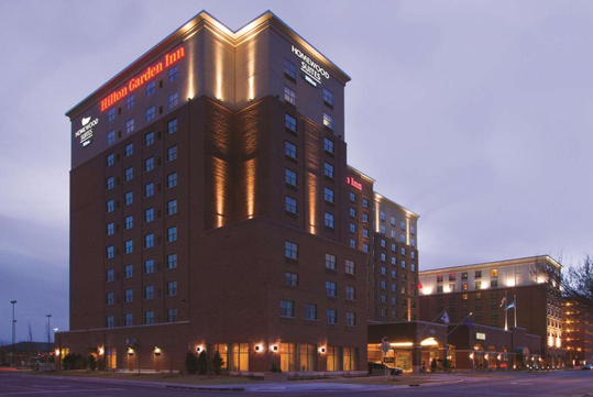 Hotel exterior at dusk.