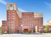 Hotel exterior on a bright, sunny day.