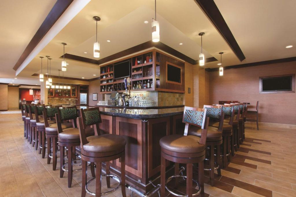 Unwind with your favorite drink in the on-site bar with high chairs.