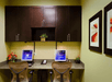 Business center with chairs, desk, and computers.