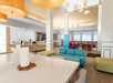 Step into a spacious lobby with stylish décor and cozy lounge area.