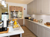 Start your day in the breakfast area with bagels, fresh fruits, and coffee.