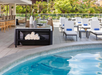 Outdoor pool with sun loungers.
