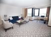 Living room with sofa bed and work desk & chair.