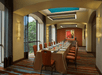 Meeting facility equipped with tables and chairs.